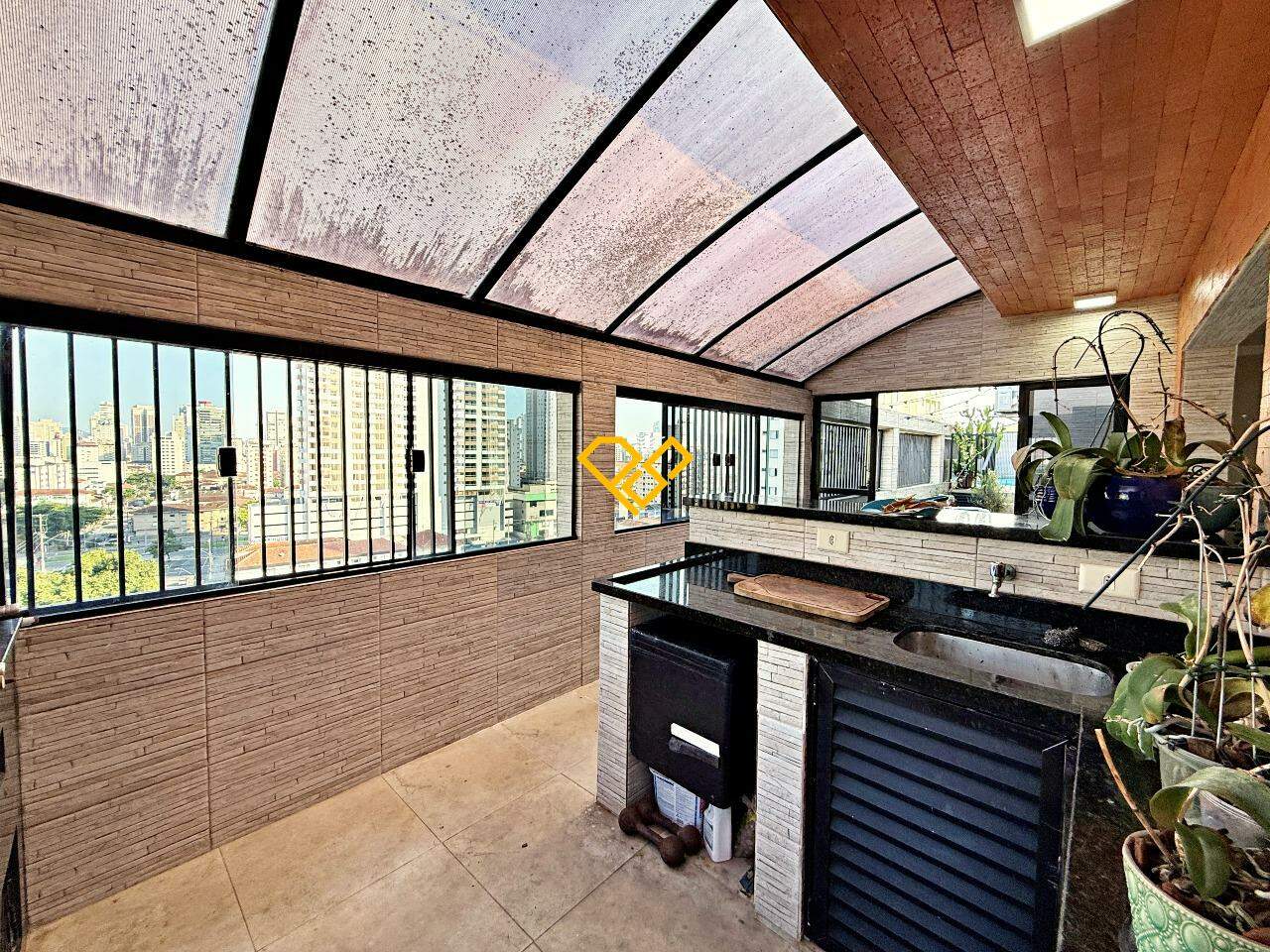 Cobertura à venda no Vila Mathias: Área gourmet com churrasqueira