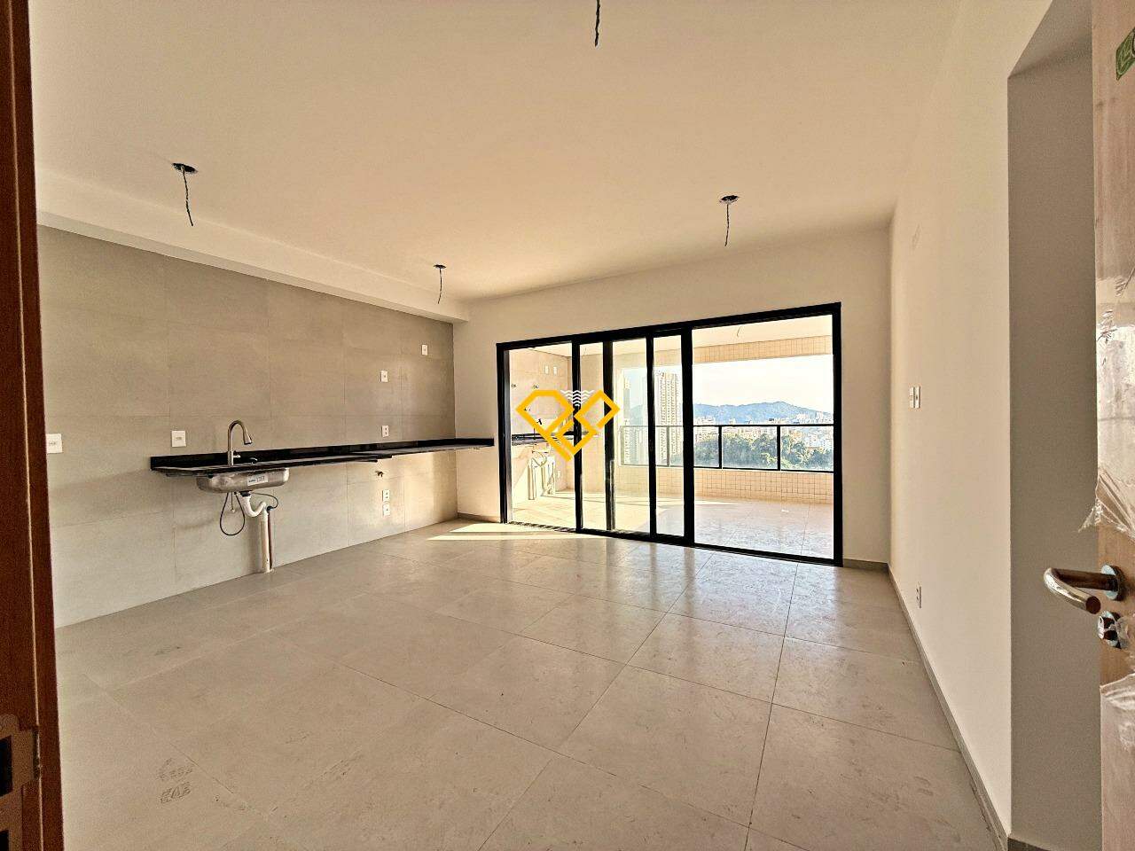Apartamento à venda no José Menino: Sala e cozinha integrada