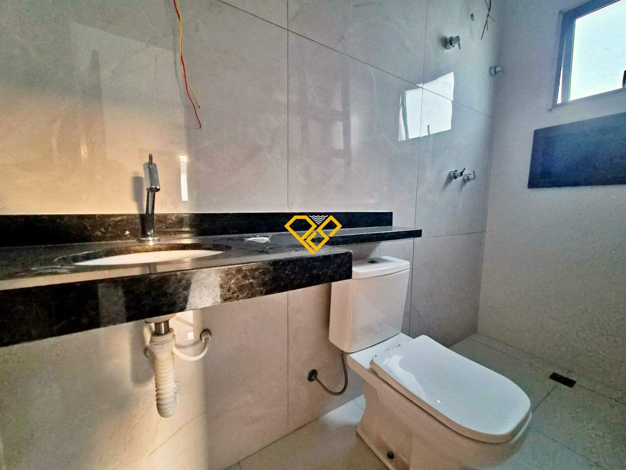 Sobrado à venda no Estuário: Wc suíte 1