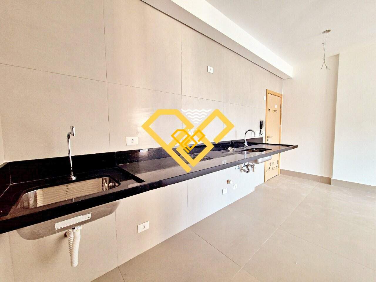 Apartamento à venda no José Menino: Área serviço e cozinha