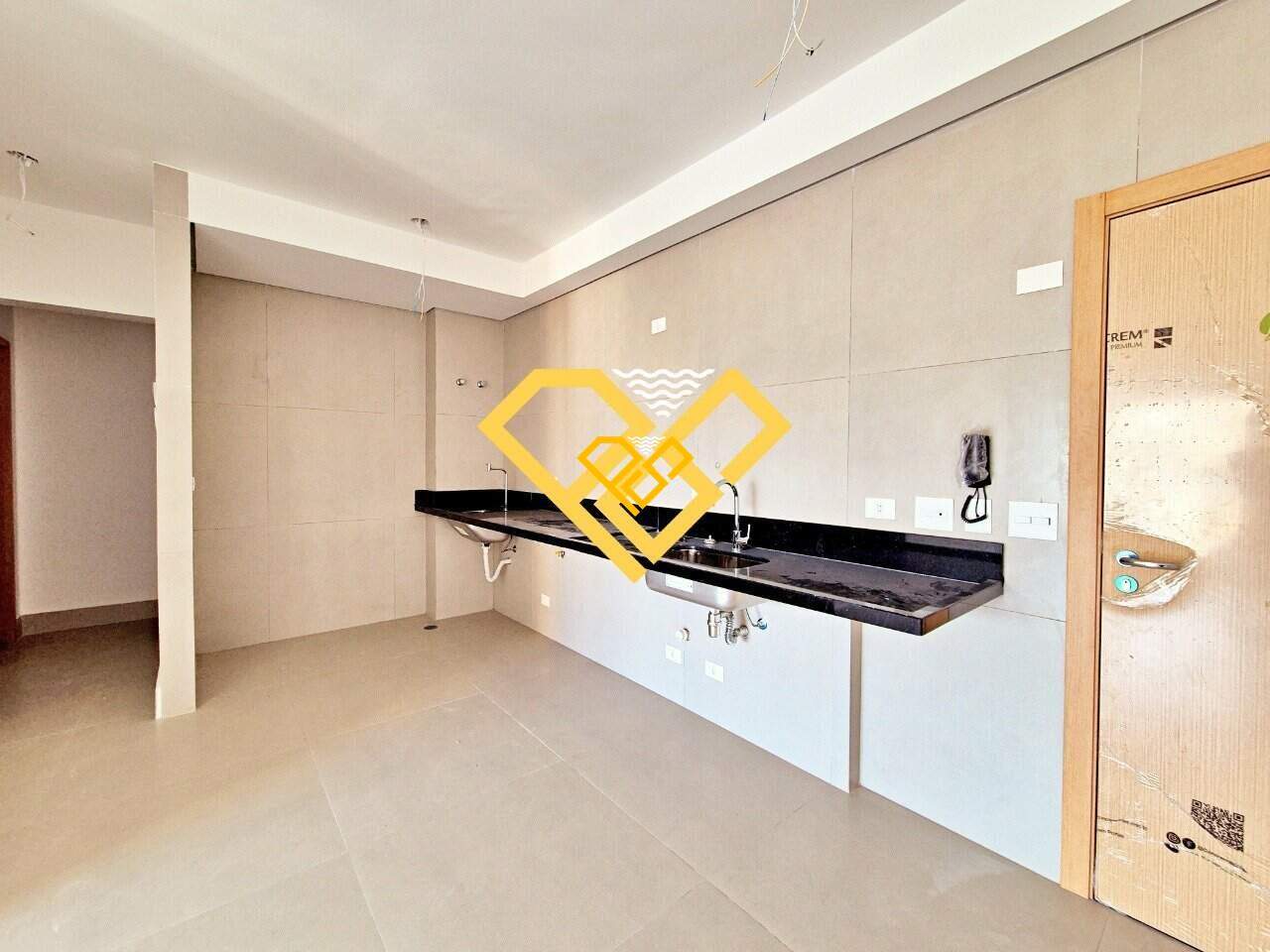 Apartamento à venda no José Menino: Cozinha integrada com área serviço