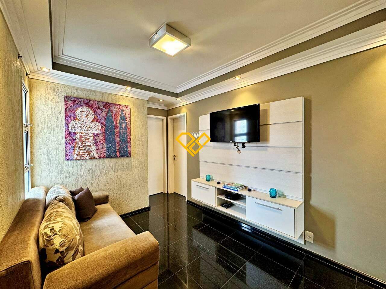 Apartamento à venda no Ponta da Praia: Sala de tv