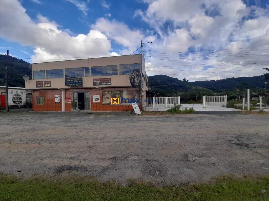 Terreno à venda no São Nicolau: Frente do imóvel, sala comercial e terreno ao lado.