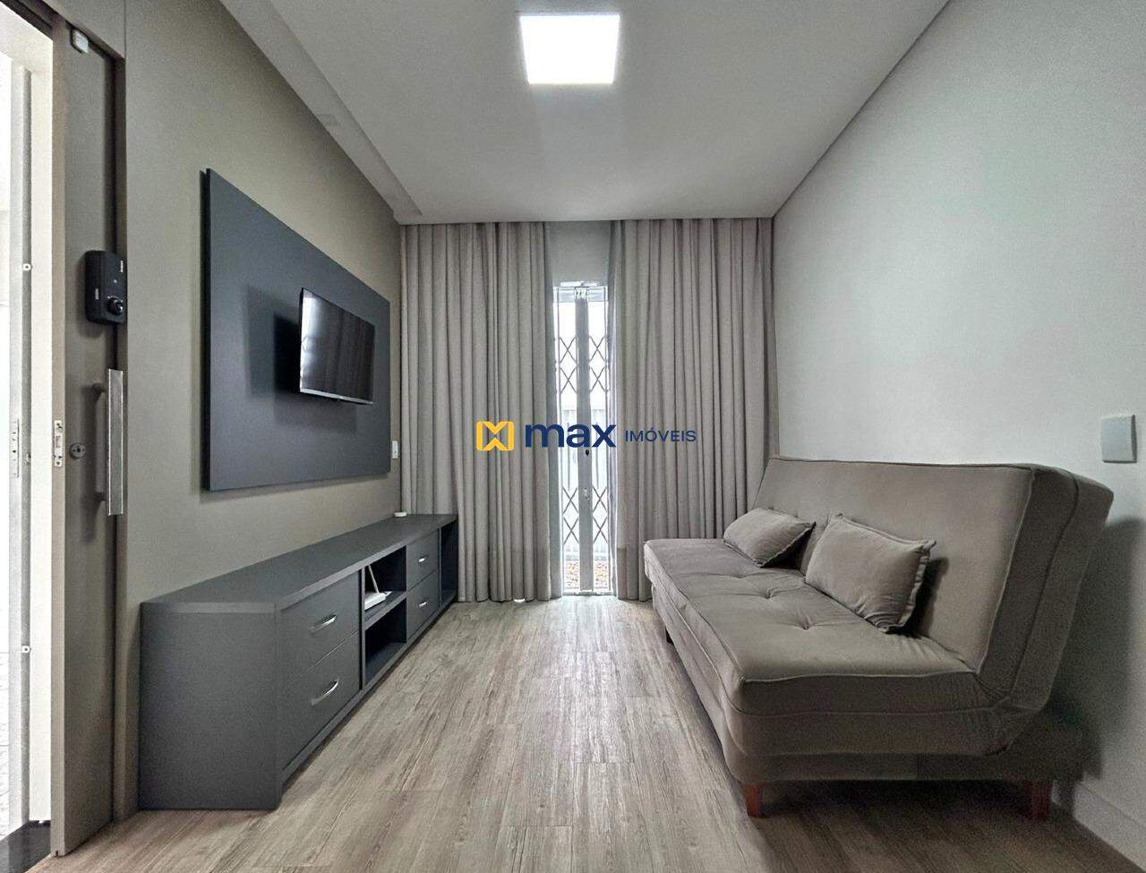 Casa à venda no Centro: Sala de estar e TV