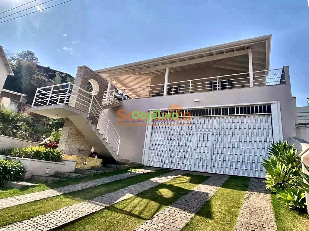 Casa de Condomínio à venda no Parque Delfim Verde: fachada com garagem coberta e jardim de entrada
