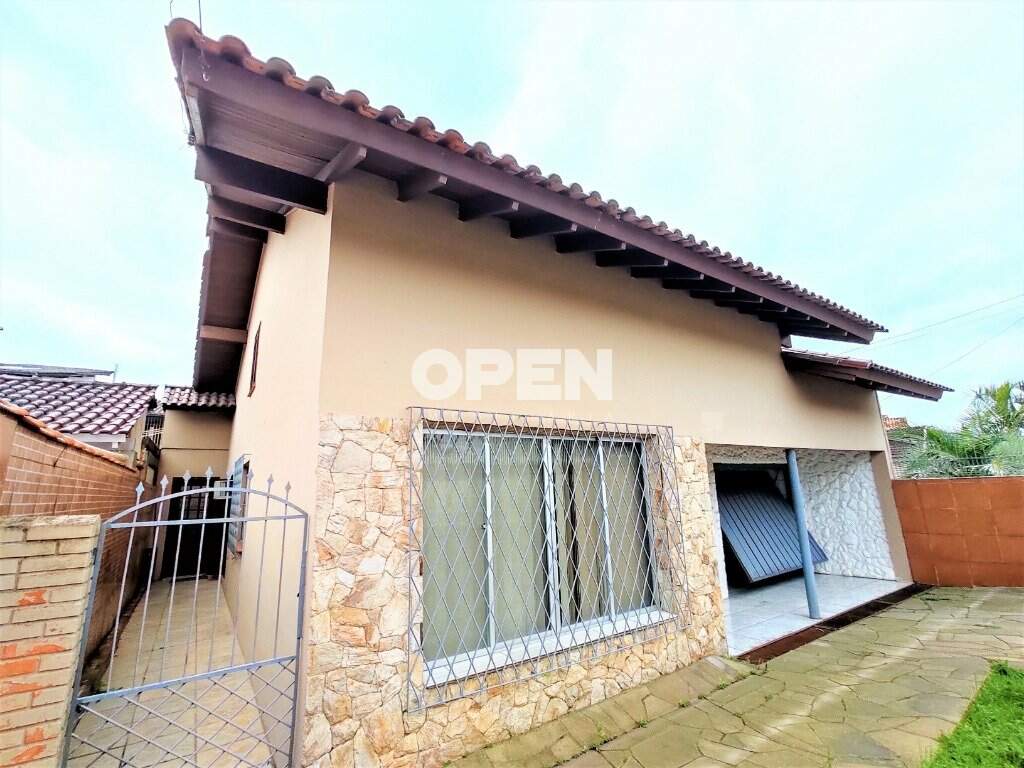 Casa com 312m², 3 dormitórios, 1 suíte, 3 vagas no bairro Nossa Senhora das Graças em Canoas para Comprar