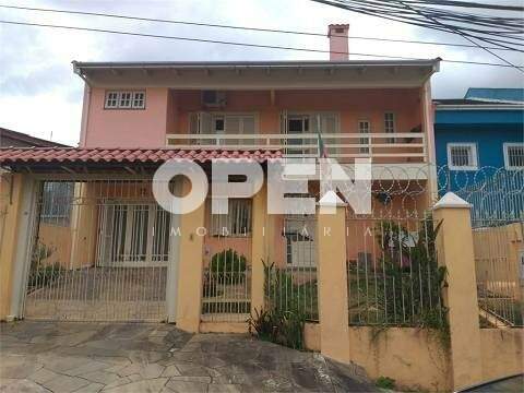 Sobrado com 194m², 3 dormitórios, 1 suíte, 7 vagas no bairro Nossa Senhora das Graças em Canoas para Comprar