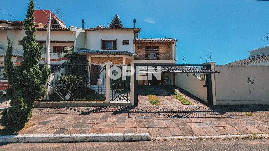 Casa com 320m², 5 dormitórios, 1 suíte, 2 vagas no bairro Marechal Rondon em Canoas para Comprar