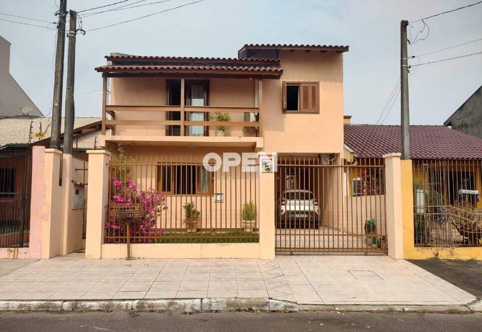 Casa com 230m², 3 dormitórios, 1 suíte, 2 vagas no bairro Igara em Canoas para Comprar