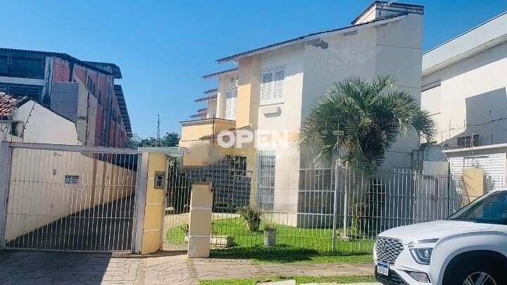 Casa em Condomínio  com 78m², 2 dormitórios, 1 vaga no bairro Nossa Senhora das Graças em Canoas para Comprar