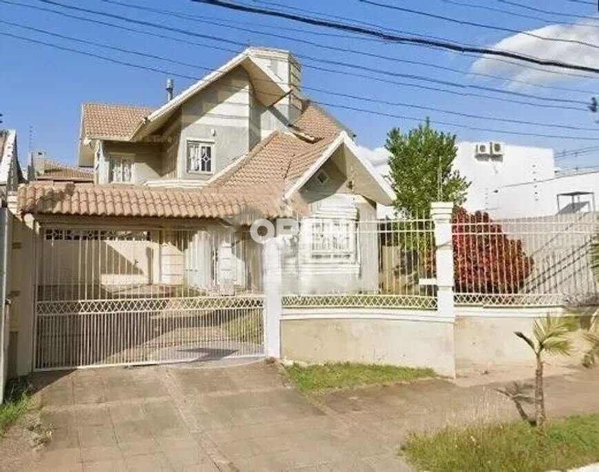 Sobrado com 256m², 3 dormitórios, 1 suíte, 2 vagas no bairro Marechal Rondon em Canoas para Comprar