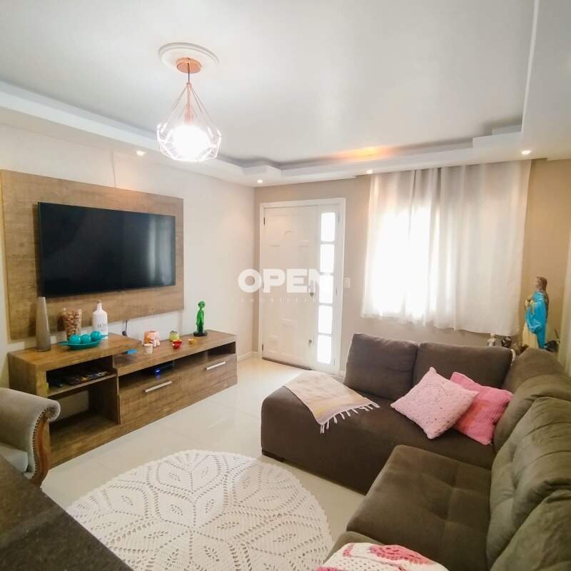 Casa com 120m², 3 dormitórios, 1 suíte, 2 vagas no bairro Mont Serrat em Canoas para Comprar