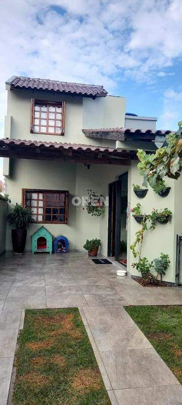 Sobrado com 100m², 3 dormitórios, 1 suíte, 2 vagas no bairro Igara em Canoas para Comprar