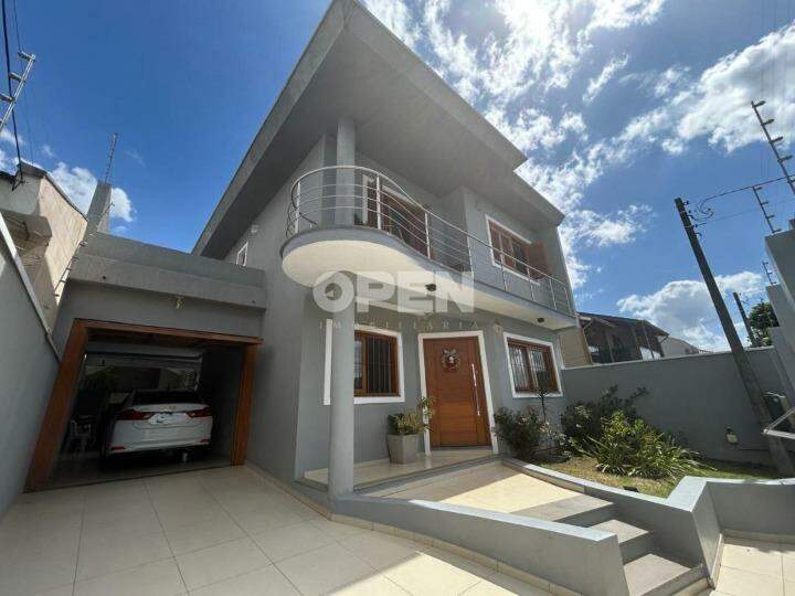 Sobrado com 177m², 3 dormitórios, 1 suíte, 4 vagas no bairro Igara em Canoas para Comprar