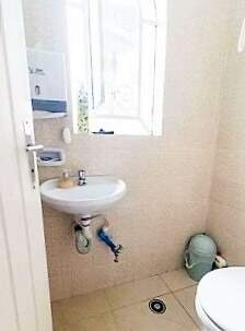 Área de serviço com banheiro