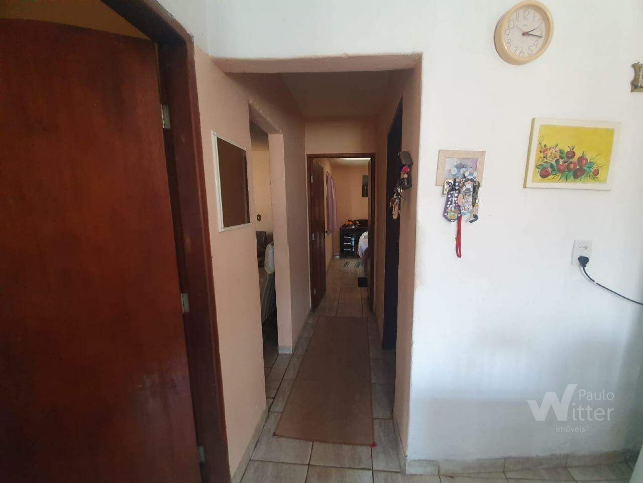 Casa à venda no Jardim Planalto: corredor casa frente 
