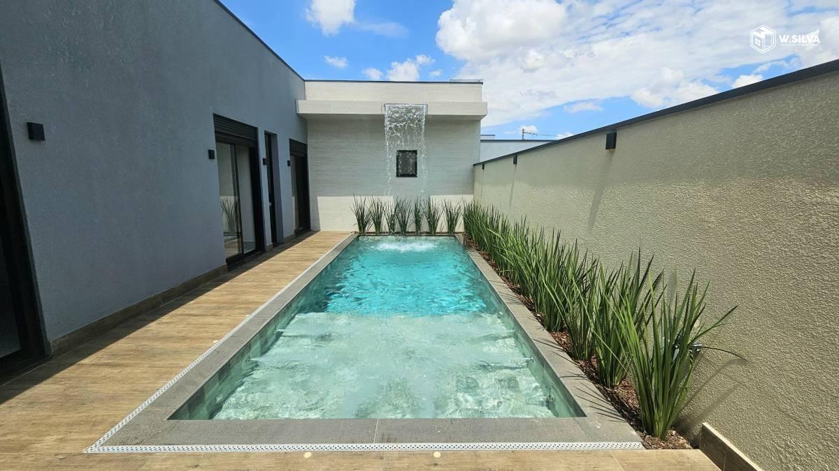 Casa em Condomínio à venda no Residencial Evidências: Piscina com cascat